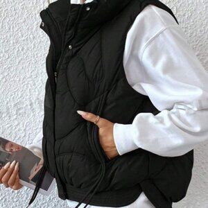 Black vest. New. Large. 8/10